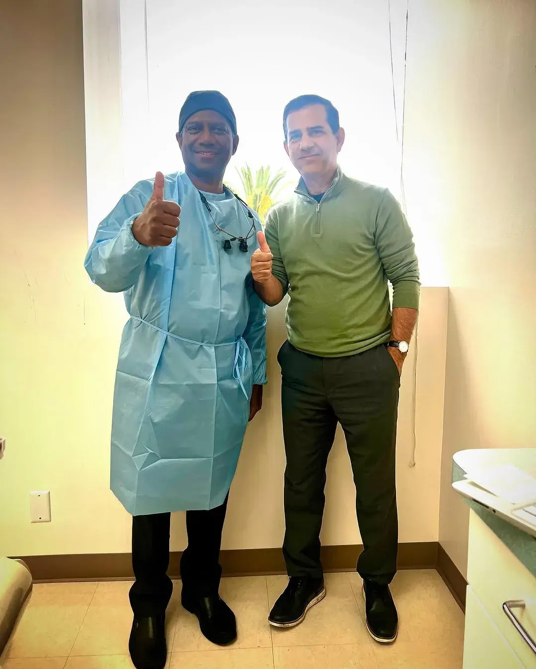 Dr. Khaled with a smiling patient